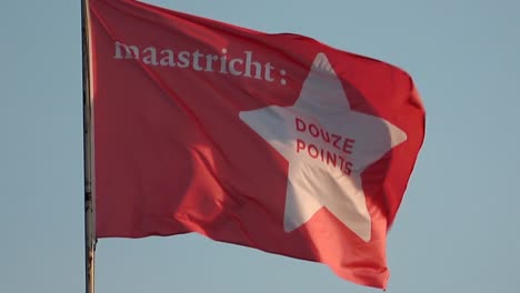 A-slow-motion-flag-waving-in-the-wind-reads-Maastricht-douze-points,-promoting-the-city-of-Maastricht-as-location-for-Eurovision-Songfestival-in-2020