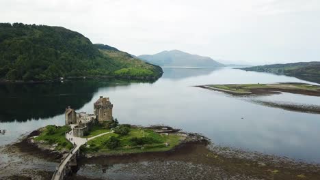 Eilean-Donan-castle-on-island-in-Loch-Duich,-Scotland,-aerial-view