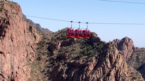 Royal-Gorge-Aerial-Gondola-ride-on-sky-and-jagged-mountain-rocks-background