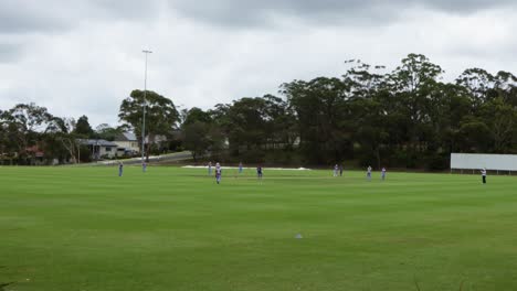 wide-shot-of-cricket-field-with-womens-game-playing-on-overcast-day