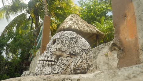 Mexican-sculpted-skull-on-tropical-stairs