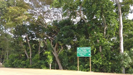 Approaching-an-intersection-of-the-Dauis-Panglao-road-of-Bohol,-Philippines