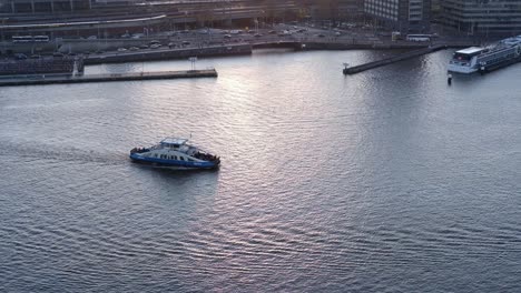 Amsterdam-ferry-driving-during-dawn-from-above