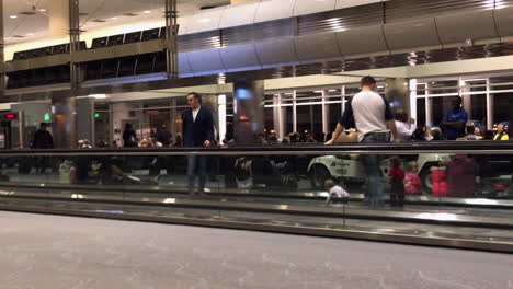 dads-and-kids-playing-on-escalator-in-airport
