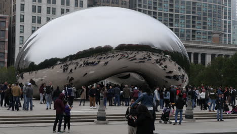 Cloud-Gate-in-Millennium-Park-with-Chicago-skyline-and-skyscrapers-shot-in-4k-high-resolution