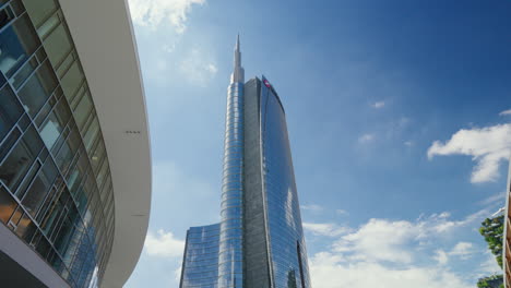 Modern-UniCredit-skyscraper-dominating-Milan-skyline-against-blue-skies