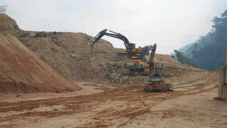Heavy-machinery-doing-the-earthwork-site-clearing-at-the-construction-site