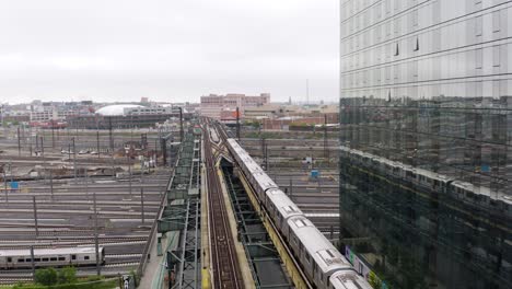Aerial-Tracking-Shot-of-Subway-Train-in-NYC-on-Foggy-Day