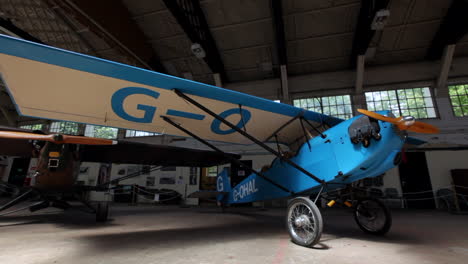Stunning-Slide-Wide-Shot-of-an-Airplane-in-Hangar