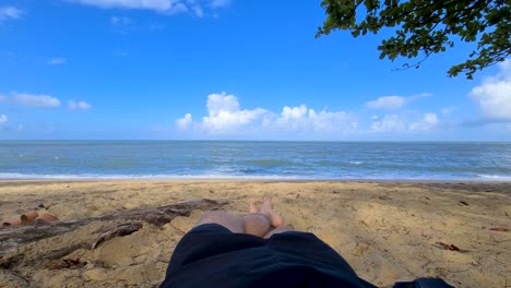 POV-Of-Young-Male-Lying-On-Turtle-Creek-Beach-By-The-Ocean
