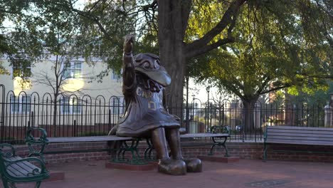 A-rotating-camera-shot-around-the-statue-of-the-University-of-South-Carolina-mascot,-Cocky