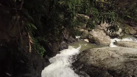 Drone-footage-going-down-a-creek-from-a-waterfall-in-Puerto-Rico