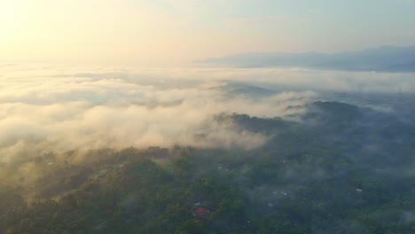 Endless-horizon-of-Indonesia-with-mountains-and-fog,-aerial-view