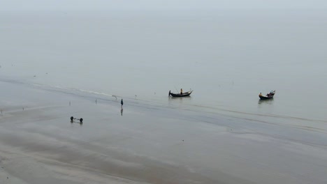 Kuakata-Beach,-Bangladesh---Fishing-Boats-Departing-From-the-Coastline-Amidst-the-Monsoon-Season---Wide-Shot