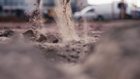 Close-up,-scooping-dirt-with-shovel-at-a-construction-site