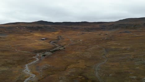 Aerial-View-of-Stream-Flowing-Through-Valley