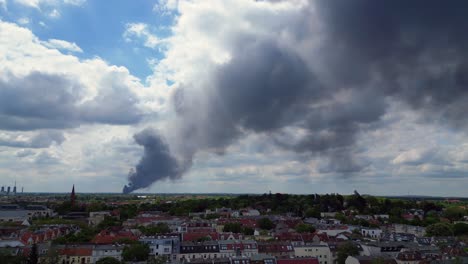 catastrophic-Dense-smoke-plume-major-fire-above-berlin-cloudy-skyline