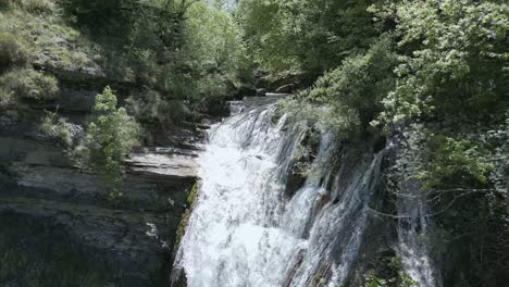 Soar-above-an-enchanting-waterfall-in-Italy-with-this-breathtaking-drone-footage