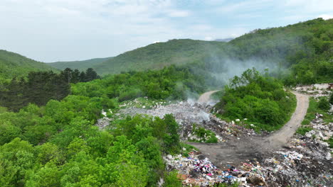 Aerial-view-of-a-garbage-dump-that-is-burning-in-places
