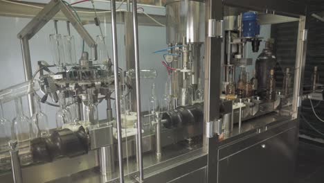 Rose-Wine-Bottling-Production-Line---Nitrogen-Sparging,-Filling,-And-Corking-Machines-In-Row