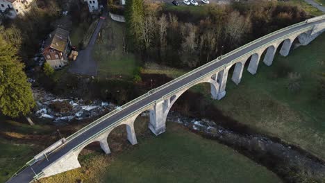 Top-view-of-beautiful-stone-arch-bridge-in-Mieussy,-France