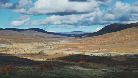 A-narrow-road-leads-through-the-desolate-tundra-landscape