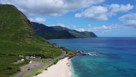 drone-video-of-cars-driving-in-hawaii-next-to-the-ocean