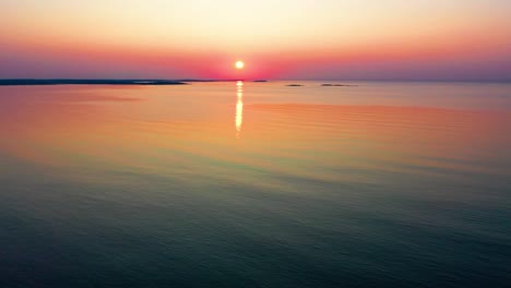 Beautiful-Ocean-Sunrise-Illuminates-the-Sky-with-Colorful-Orange,-Red-and-Yellow