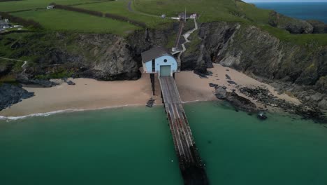 RNLI-Padstow-Lifeboat-Station-Aerial-Panning-Shot-with-Drone-Over-Cornish-Waters,-UK