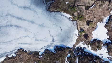 Overhead-View-Of-Frozen-Palvatnet-Lake-During-Winter-In-Daytime-In-Norway