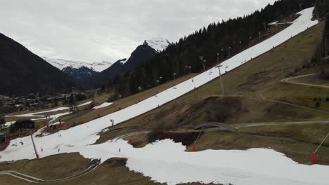 Empty-and-melted-ski-slopes-in-Morzine,-French-alps-during-record-warm-month-of-March