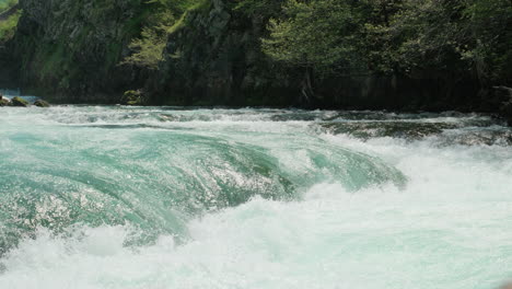 A-waterfall-of-a-pure-wild-river-located-in-a-green-rainforest