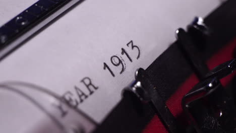 Year-1913,-Typing-on-White-Paper-in-Vintage-Typewriter,-Macro-Close-Up