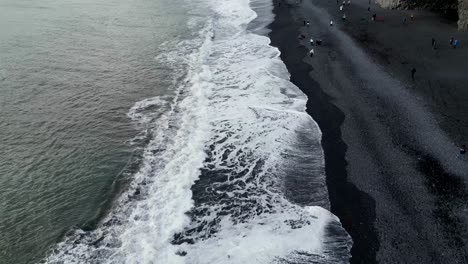 Drone-shot-of-black-beach-in-iceland-during-winter-in-the-morning