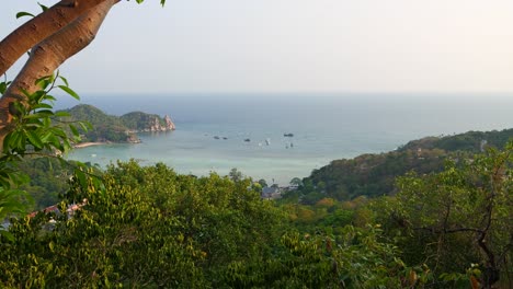 High-above-panorama-view-over-open-ocean-on-tropical-jungle