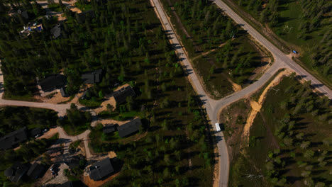 Aerial-high-angle-shot-of-a-motorhome-driving-in-Inari-Saariselka,-summer-in-Finland