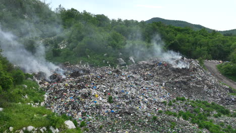 Aerial-view-of-a-garbage-dump-that-is-burning-in-places