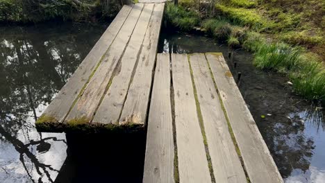 Wooden-plank-bridge-at-Tenjuan-Buddhist-Temple,-Kyoto-Japan