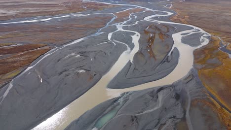 Many-river-streams-confluence-with-grey-slit-and-mud-in-brown-plains