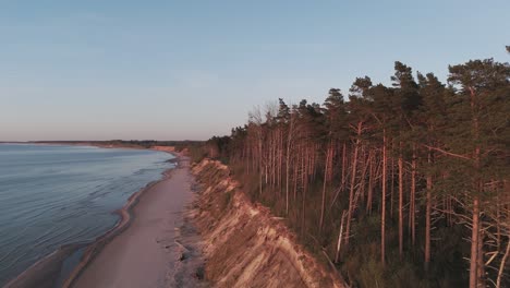 Establishing-Aerial-Shot-of-Coastline-Baltic-Sea-Jurkalne-on-Evening-at-Sunset