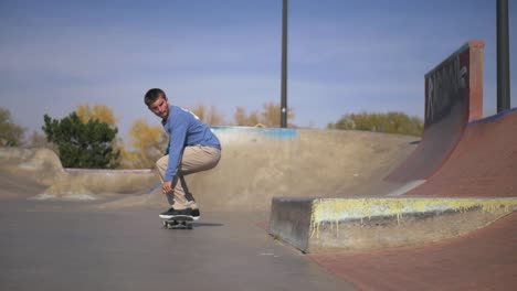 skateboarder-does-a-difficult-trick-on-a-ledge-at-the-skatepark-in-slow-motion