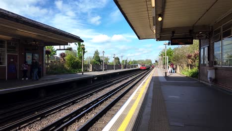 1973-Stock-Piccadilly-Line-Train-Departing-Rayners-Lane-Station-Platform-On-Sunny-Day