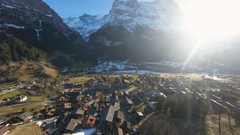Village-of-Grindelwald-with-bright-sunlight-shining-through-mountain-pass