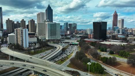 Aerial-View-Of-Busy-Urban-Traffic-Road-On-Cityscape-In-Atlanta,-Georgia---Drone-Shot