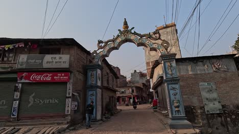 Light-traffic-flows-through-the-Bhau-Dhwakha,-or-Bride-Gate,-as-it-serves-as-the-bustling-main-entry-to-the-historic-town-of-Sankhu
