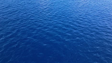 Crystal-clear-blue-nature-ocean-textured-sea-background-of-Caribbean-water
