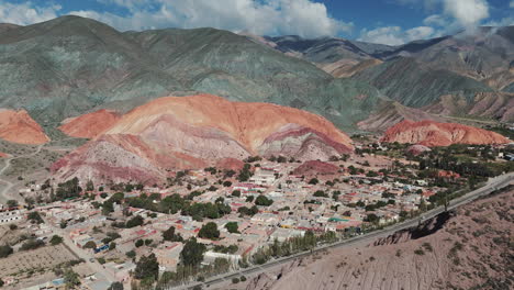 Aerial-view-of-the-Purmamarca-Cerro-Siete-Colores-town,-UNESCO-World-Heritage-Site,-Jujuy,-Argentina