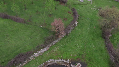 Aerial-view-of-a-well-in-cemetery-of-old-medieval-tombstone-Stecak