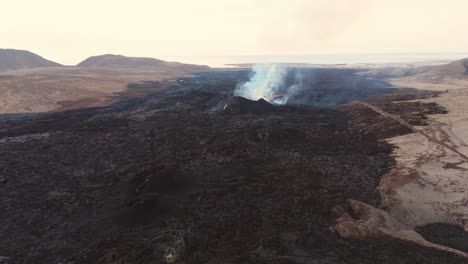 Desolate-volcanic-wasteland-with-active-smoking-volcano-in-Iceland