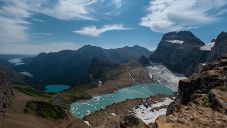 Timelapse,-Glacier-National-Park-Montana-USA,-Clouds-and-Sunny-Day-Above-Glacier,-Glacial-Lakes-and-Peaks